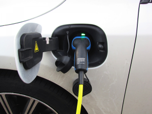 A plug-in electric vehicle being recharged