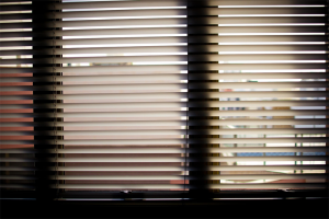 Window blinds with some slats open and some closed, a metaphor for the degrees of wickedness of a wicked problem